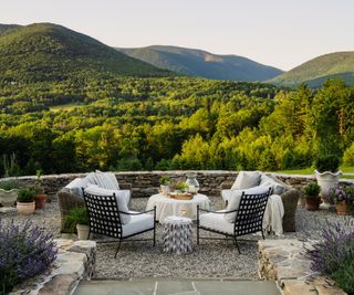 patio with garden furniture and view over hills and forests