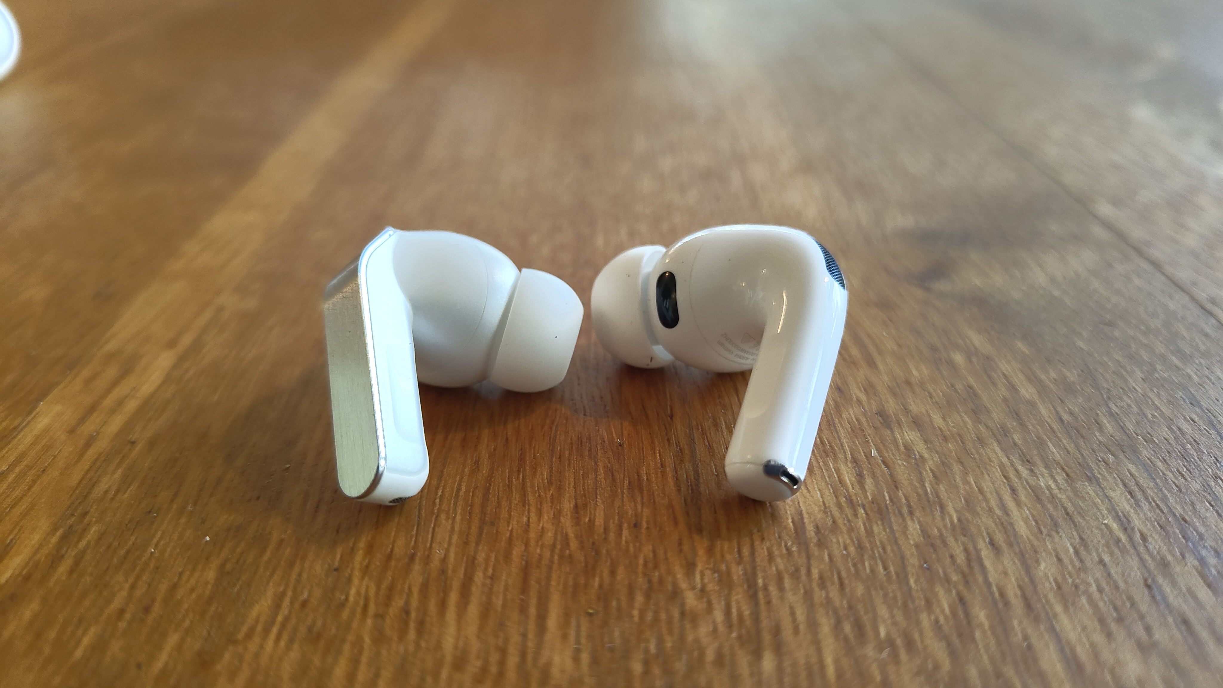 Samsung Galaxy Buds 4 Pro vs Apple AirPods Pro 3 wireless earbuds side-by-side