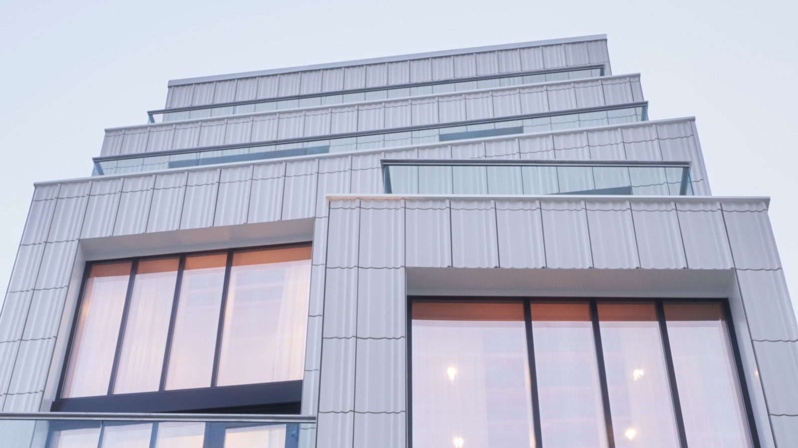 Of Possible - 103 Grand, a family of Williamsburg homes in a terracotta-clad clad stacked building in NY