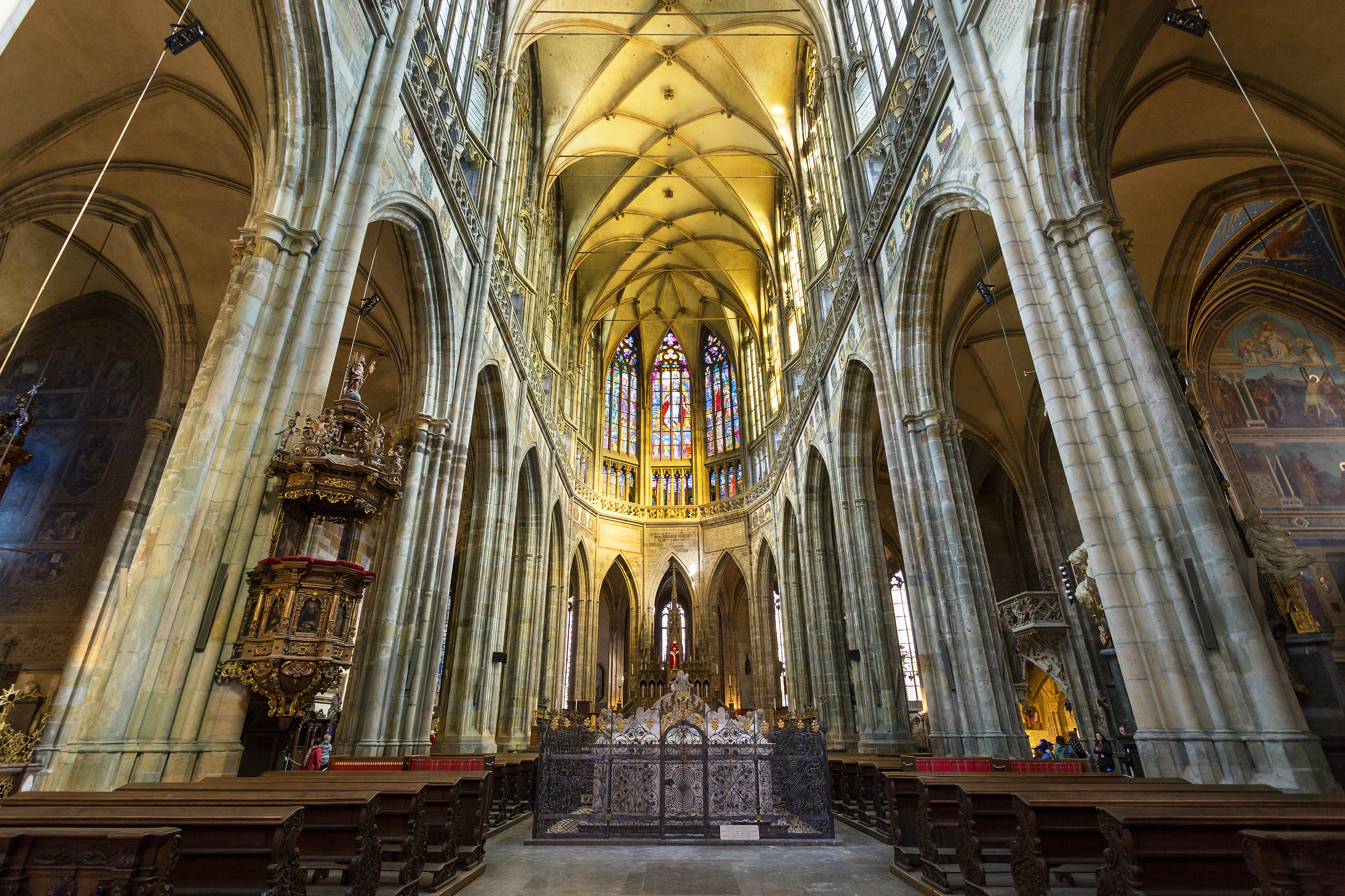 Stone and golden interior of cathedral nave