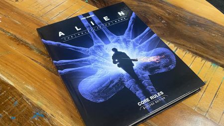 Alien RPG Evolved Edition Core Rules on a wooden surface