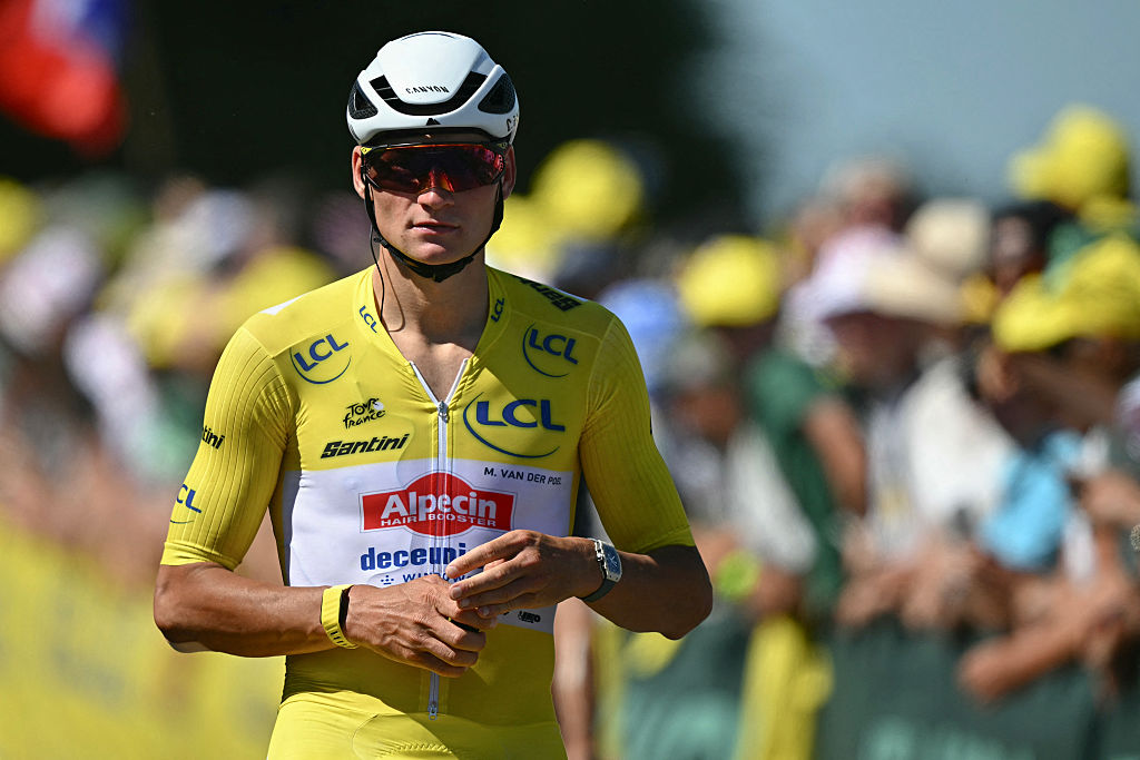 Alpecin - Deceuninck team's Dutch rider Mathieu van der Poel wearing the overall leader's yellow jersey looks on after passing the finish line during the 7th stage of the 112th edition of the Tour de France cycling race, 197 km between Saint-Malo and Mur-de-Bretagne Guerledan, in Brittany, western France, on July 11, 2025. (Photo by Loic VENANCE / AFP)