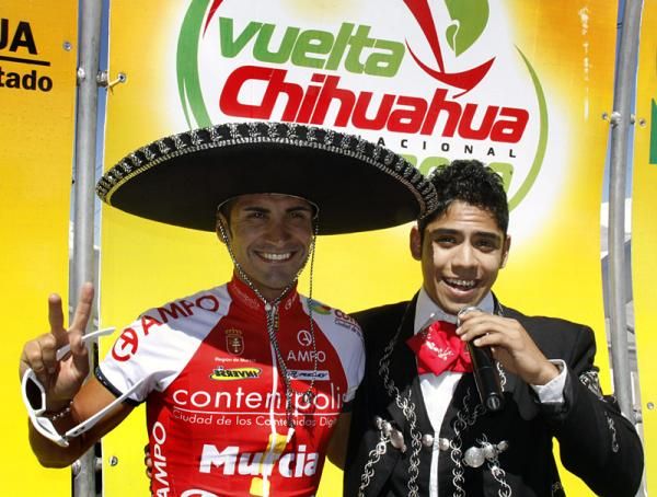 Stage winner Javier Benitez (Contentpolis-Ampo) on the podium sporting some new headgear.