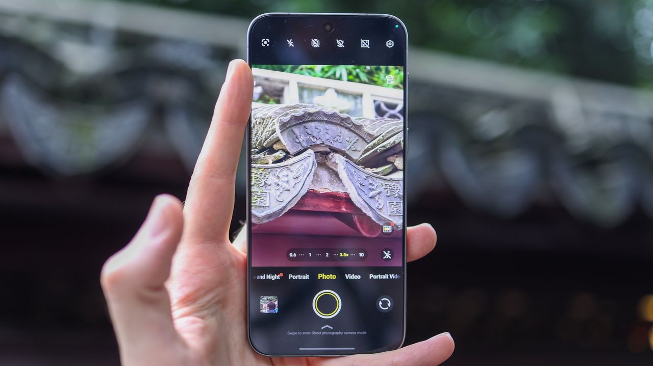Vivo X300 Pro camera phone held in a hand