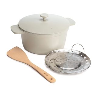Beige pot with steamer basket and spatula