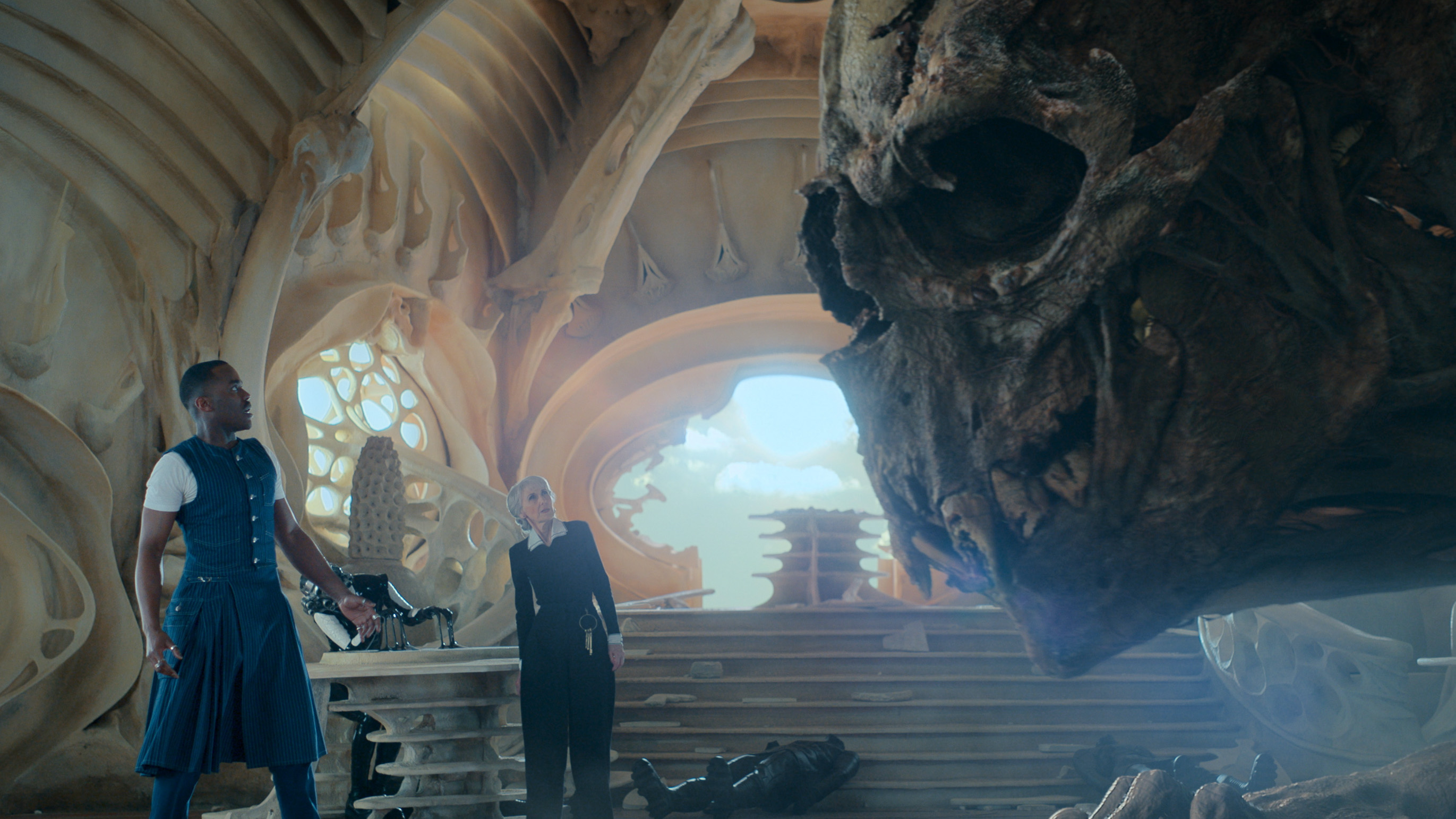 Ncuti Gatwa as the Doctor and Anita Dobson as Mrs Flood face down Omega in Doctor Who: The Reality War.