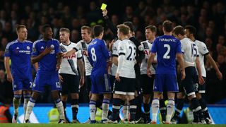 Mark Clattenburg shows another yellow card in the 'Battle of the Bridge'