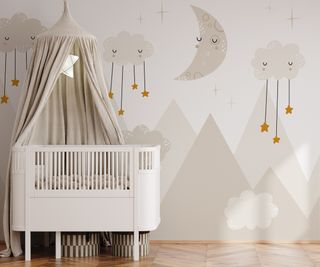 neutral wallpaper with clouds and cot with canopy