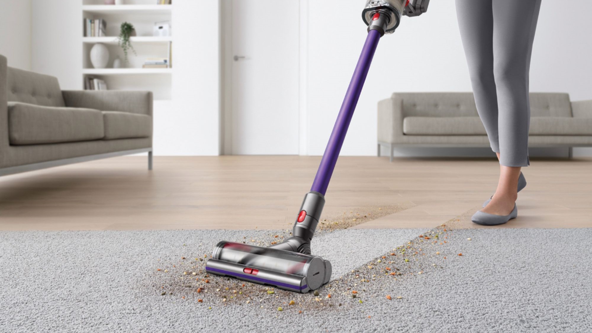 Woman cleaning floor with Dyson V11 vacuum