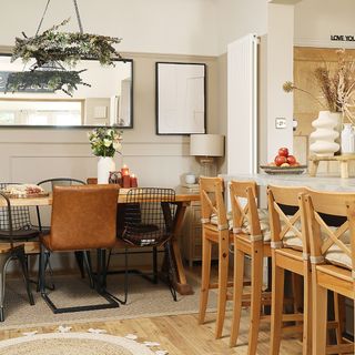 neutral dining area with island and dining table