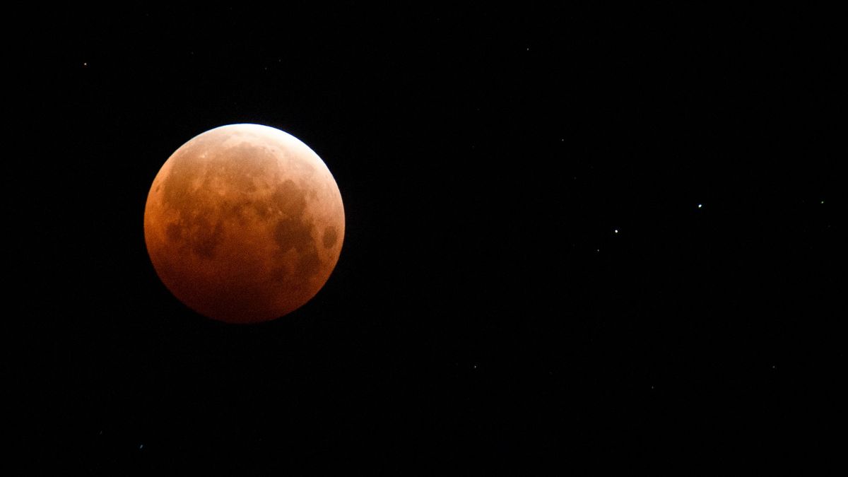 The full moon turns rusty and reddish during a total lunar eclipse. One such &quot;blood moon&quot; will appear in the sky on Nov. 8.