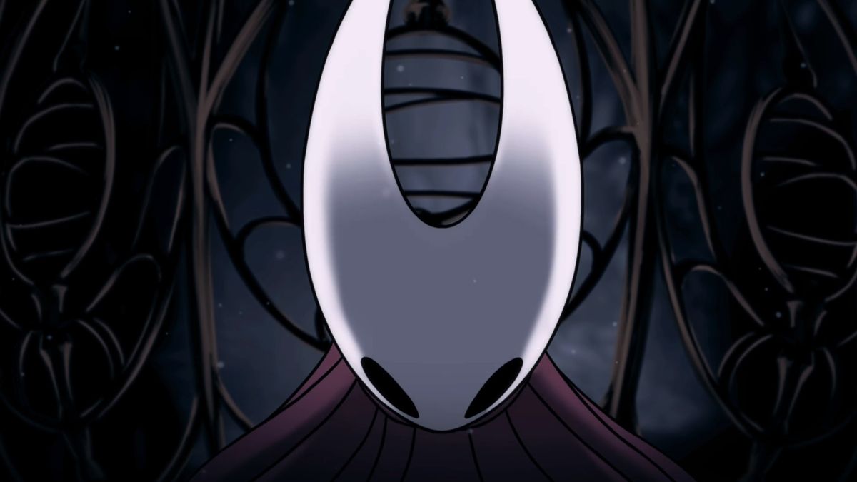 Hornet, head lowered, in Hollow Knight: Silksong within her cage in the opening cutscene