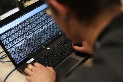 A student from an engineering school attends, on Meudon, west of Paris, overnight on March 16, 2013, the first edition of the Steria Hacking Challenge. AFP PHOTO / THOMAS SAMSON / AFP / THOMA