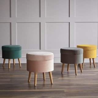 multicolor stool with wooden flooring and white wooden wall