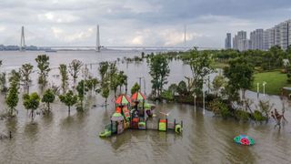 An aerial photo taken in Wuhan shows a flooded sports ground on the banks of the Yangtze River.