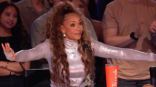 Mel B holds her arms out on America's Got Talent.