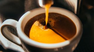 Espresso being poured from machine