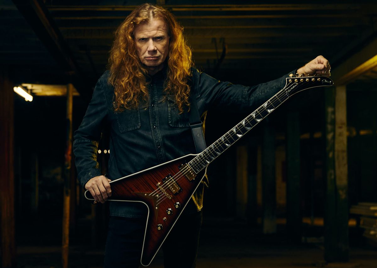 Dave Mustaine holds his new Gibson signature Red Amber Burst Flying V