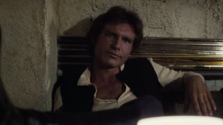 Han talking to Greedo with his feet on table