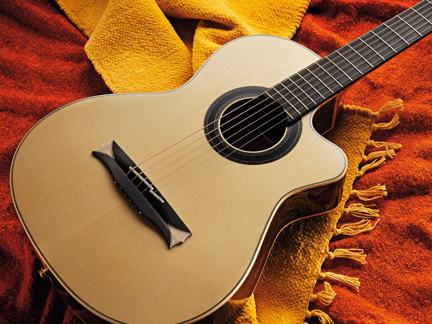 A lot like a nylon string guitar... but with steel strings.