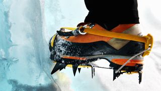 Close up of an ice climber wearing crampons