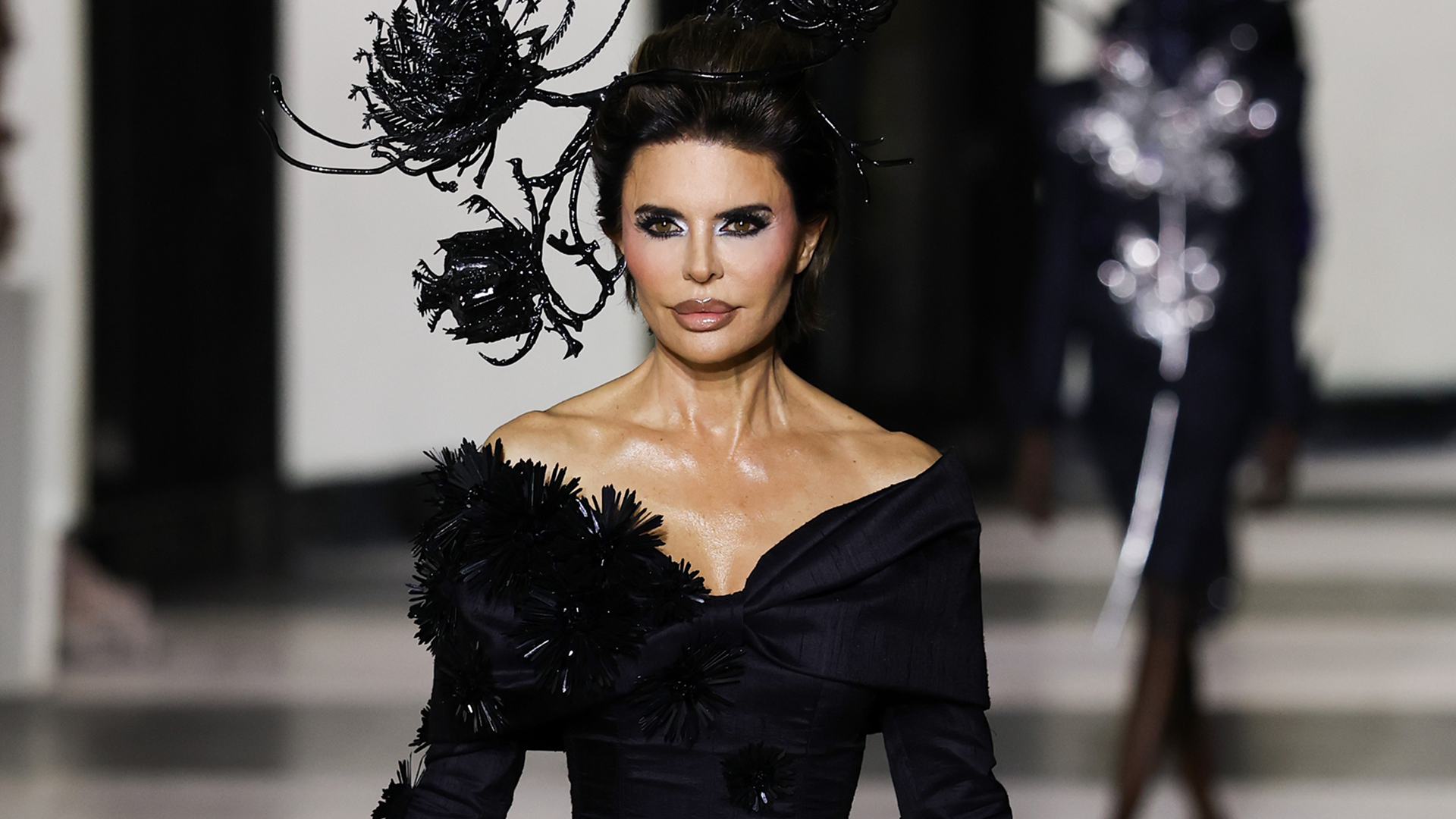 Lisa Rinna made her Haute Couture Week runway debut in a dramatic black tulle gown in Germainer's show