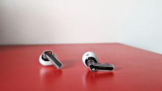 Nothing Ear (stick) review: true wireless earbuds on red shelf