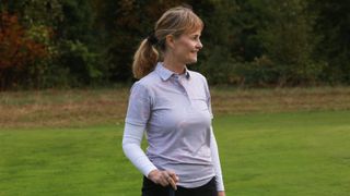 A golfer wears the Galvin Green Ladies Malena Golf Polo Shirt