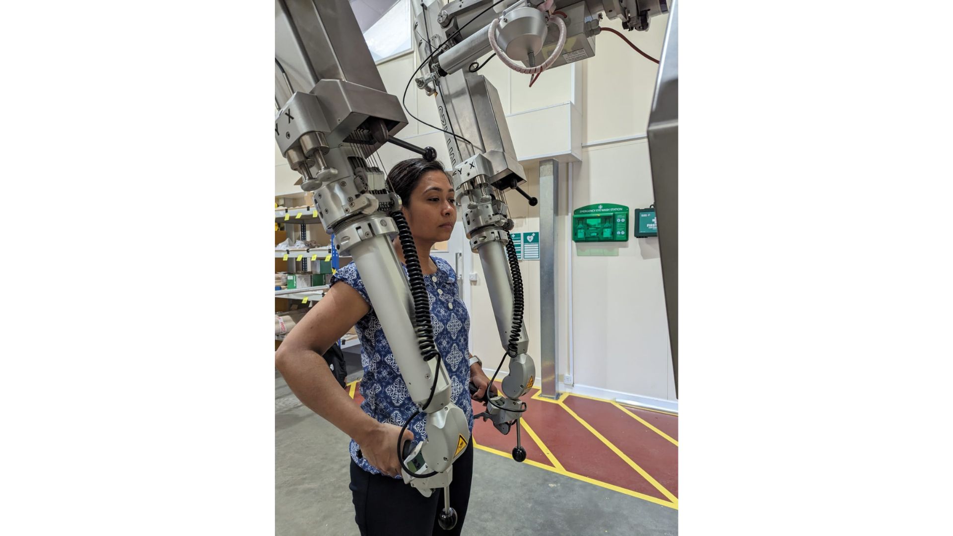 Renu Amin at work using mechanical equipment