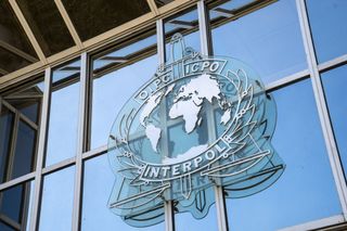 Interpol sign on a glass building