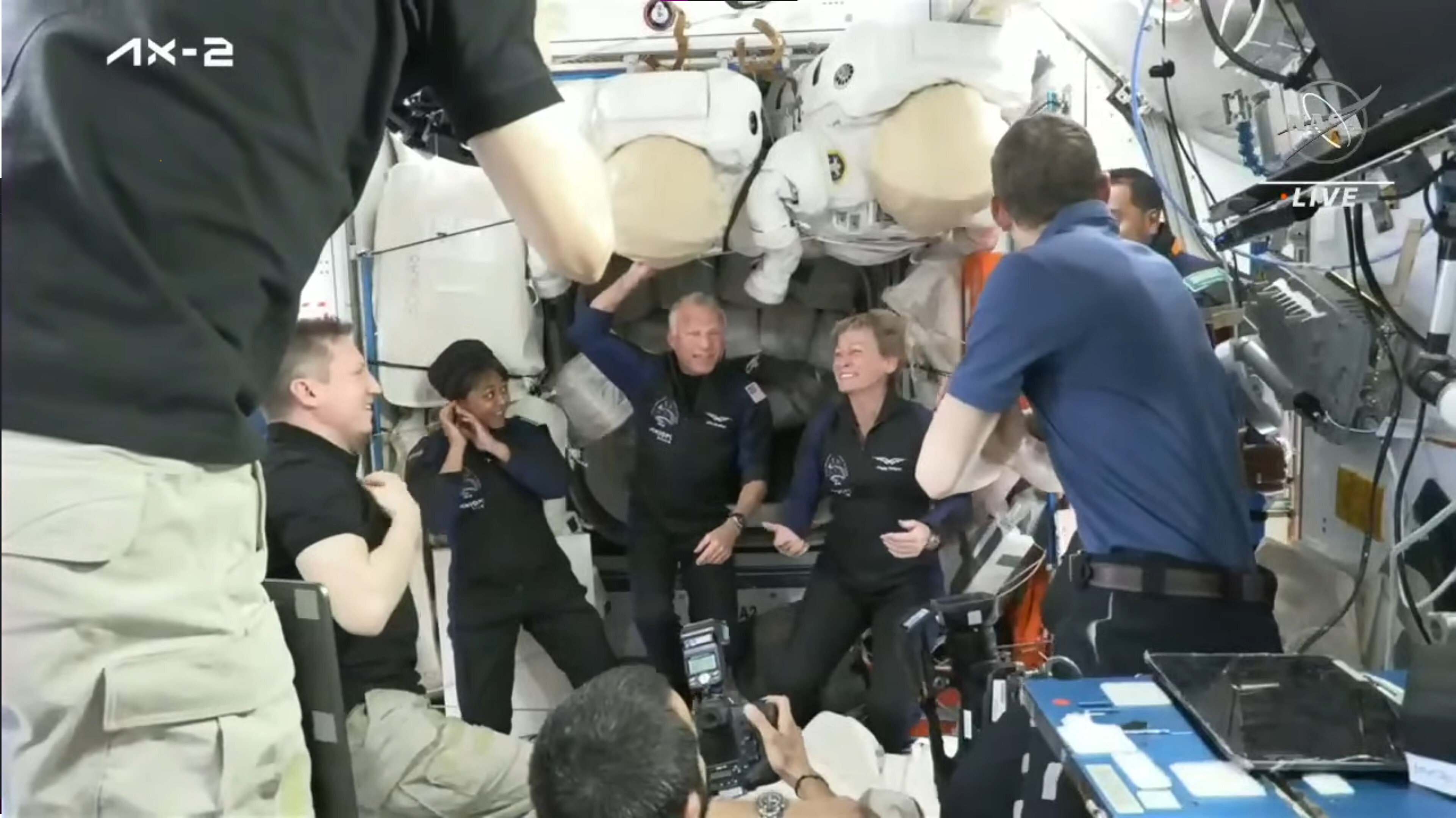 Astronauts welcome four new crewmembers from the private Ax-2 mission inside space station