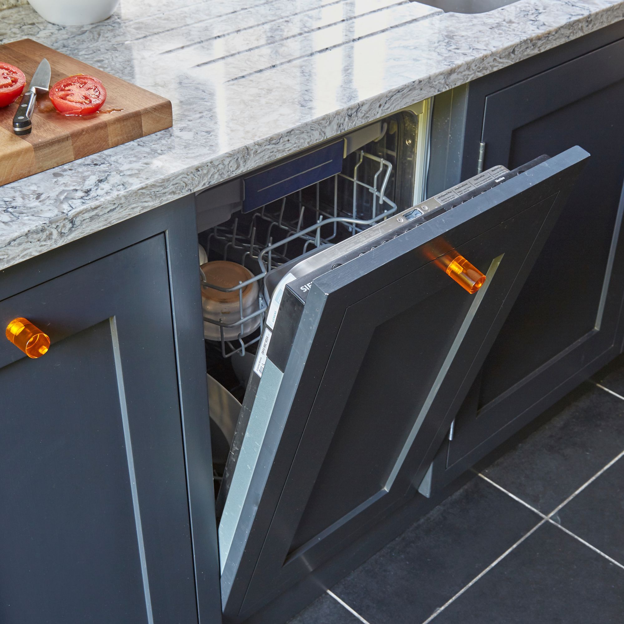 Kitchen with washing machine drawer open
