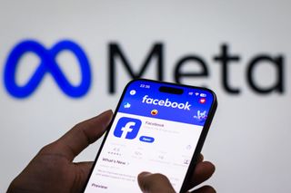 CHONGQING, CHINA - OCTOBER 30: In this photo illustration - The Facebook app page is displayed on a smartphone in the Apple App Store in front of the Meta Platforms, inc. logo on October 30, 2024 in Chongqing, China. (Photo by Cheng Xin/Getty Images)