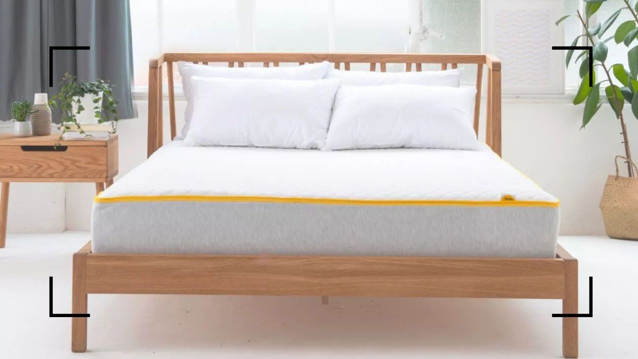 Eve Premium hybrid mattress on a wooden bed frame in a bedroom, to illustrate w&amp;h&#039;s Eve Premium Hybrid Mattress review