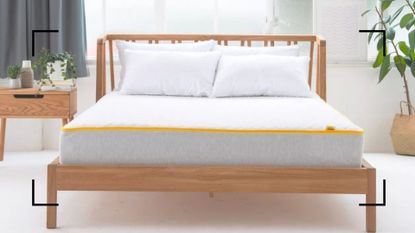 Eve Premium hybrid mattress on a wooden bed frame in a bedroom, to illustrate w&h's Eve Premium Hybrid Mattress review