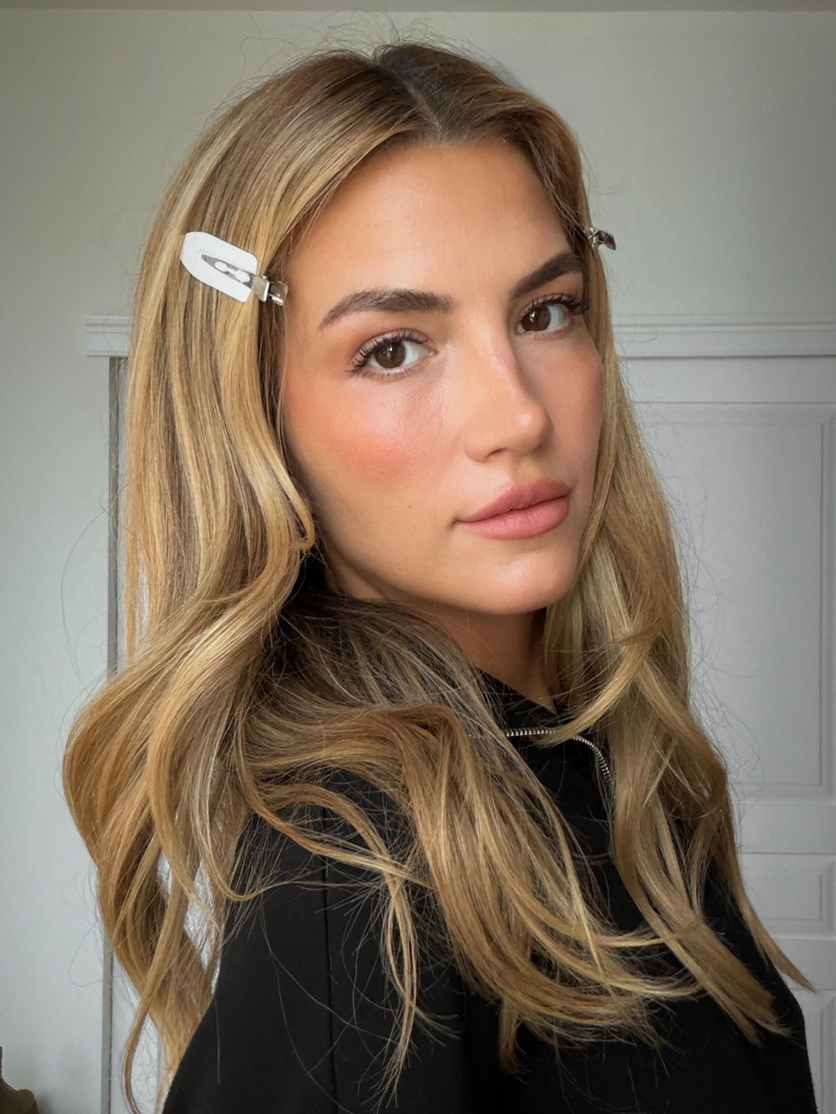 A woman with buttery blonde hair