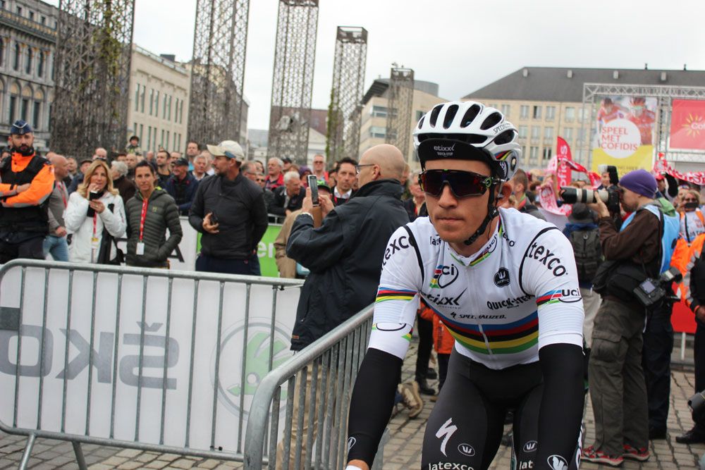 Michal Kwiatkowski rides to sign on