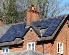 solar panels on a roof of a house - GettyImages-house-with-solar-panels
