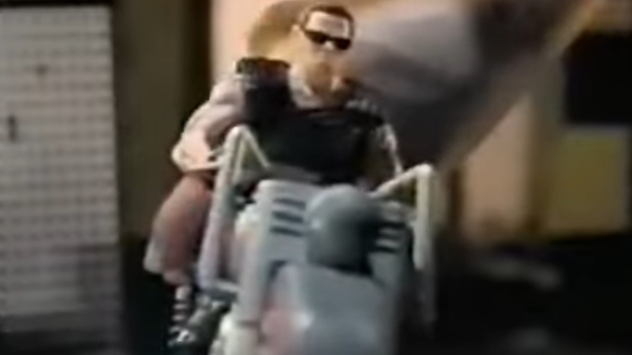A kid playing with a Terminator 2: Judgment Day action figure