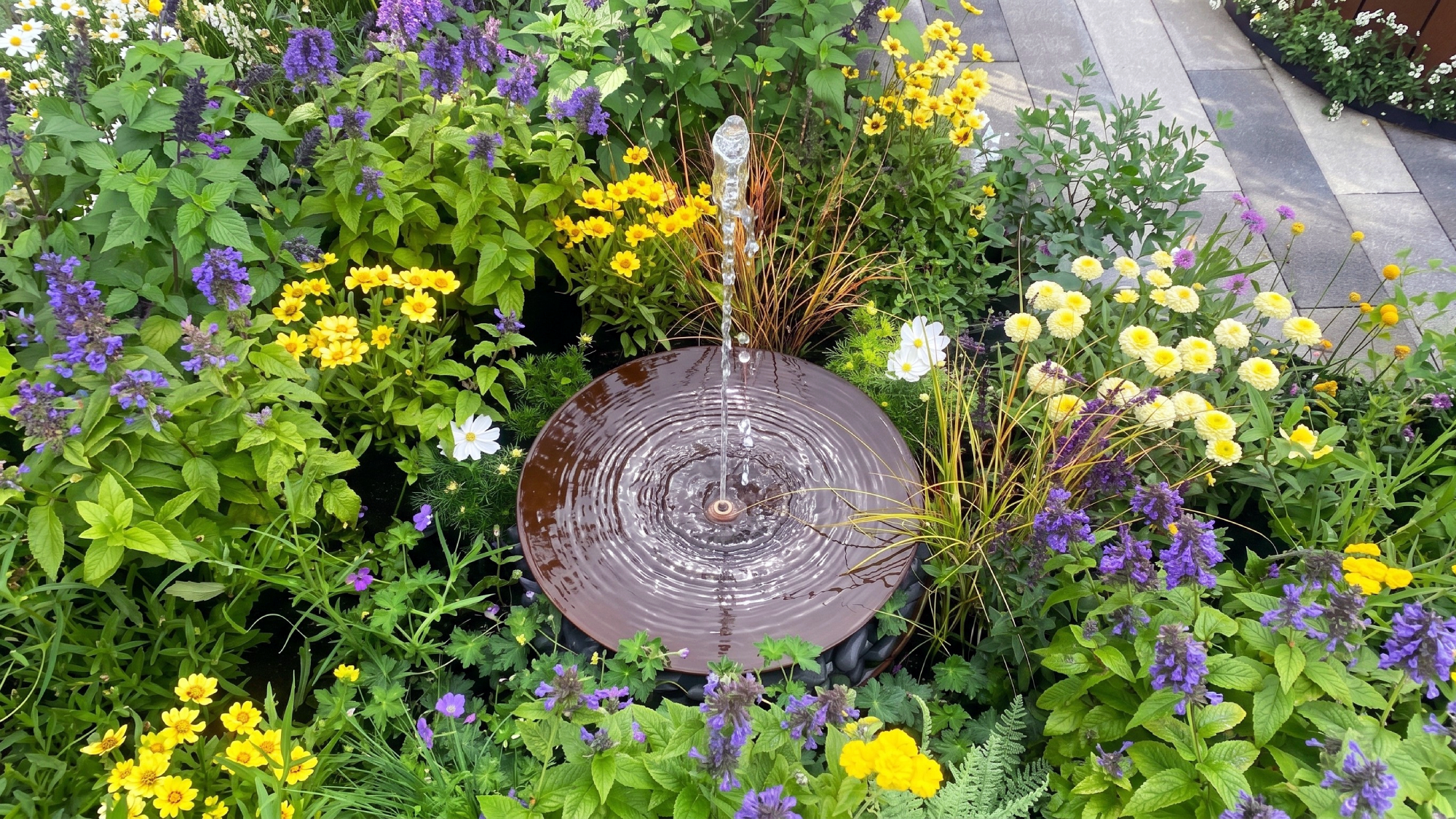 garden water feature in a border