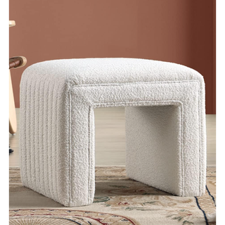boucle footstool with a square design and lined detailing
