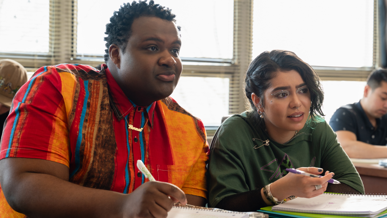 Jaquel Spivey and Auli'i Cravalho talking in class in Mean Girls.