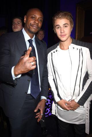 LOS ANGELES, CA - MARCH 14: Comedian Dave Chappelle (L) and honoree Justin Bieber attend the after party for The Comedy Central Roast of Justin Bieber at Sony Pictures Studios on March 14, 2015 in Los Angeles, California