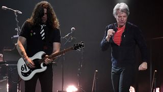 Guitarist Phil X (L) and frontman Jon Bon Jovi of Bon Jovi perform during a stop of the band's This House is Not for Sale Tour at T-Mobile Arena on March 17, 2018 in Las Vegas, Nevada