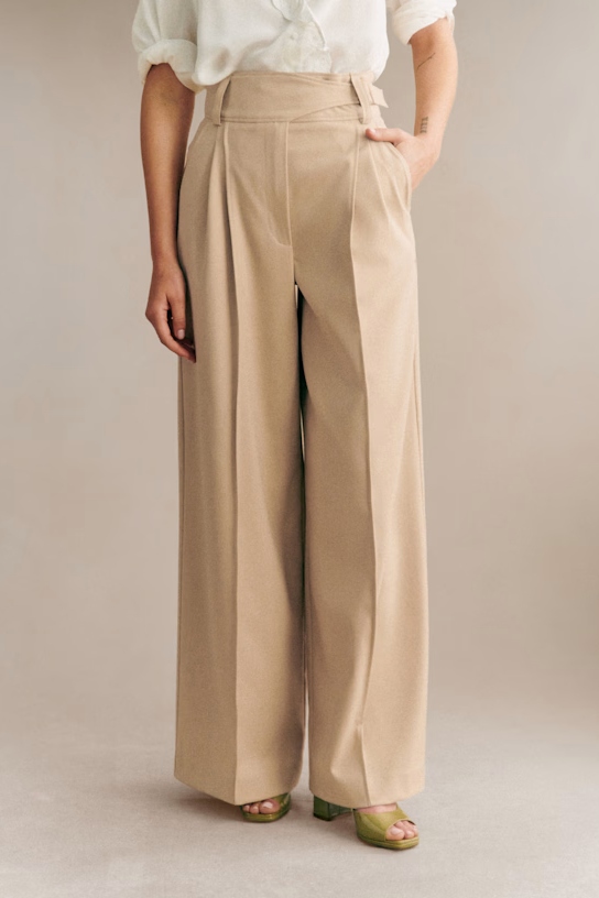 A model wearing beige pants.