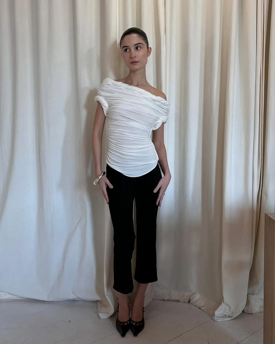 Andrea Ricci wearing kick-flare pants.