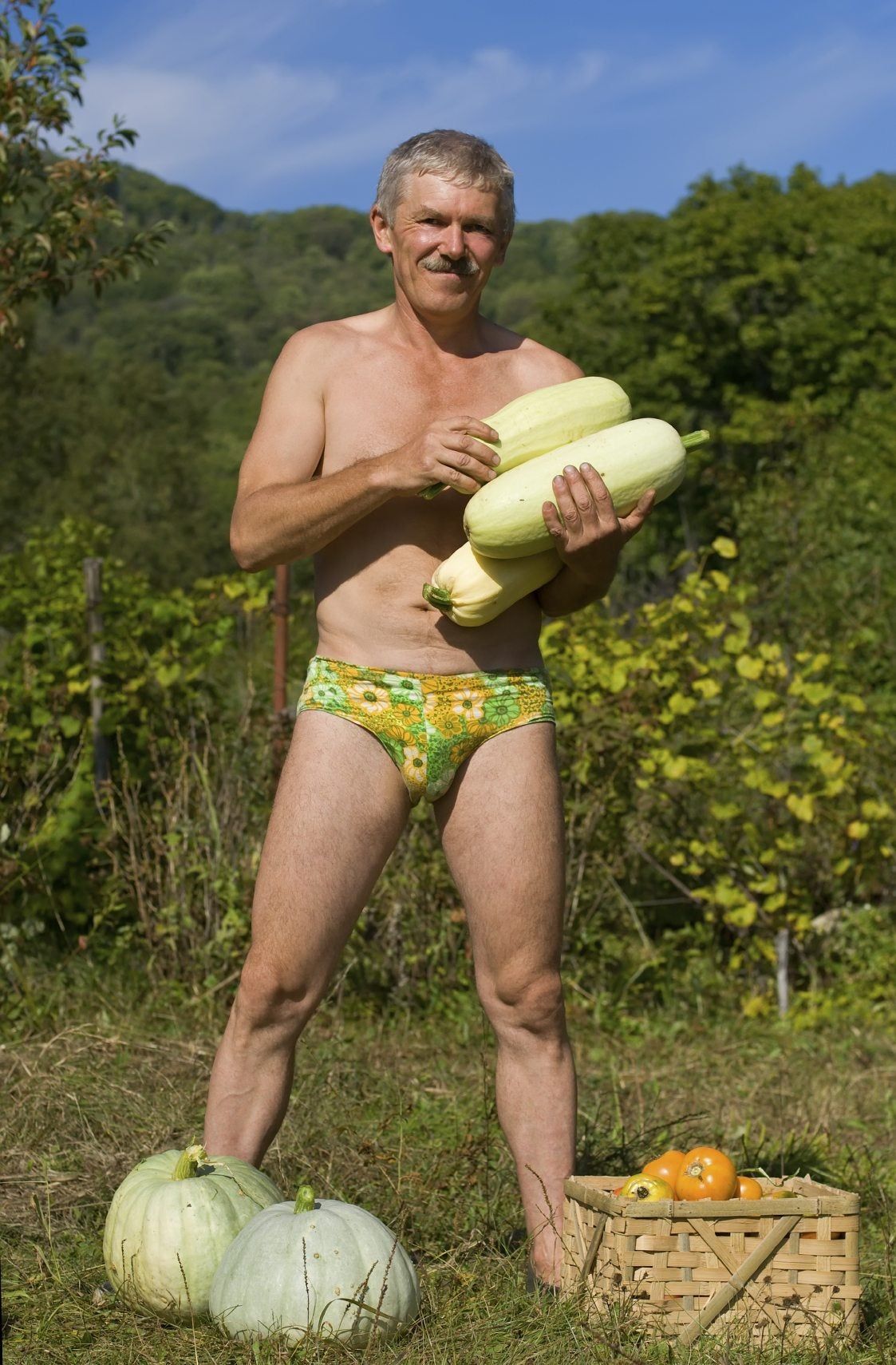 Man In Speedo Holding Squash