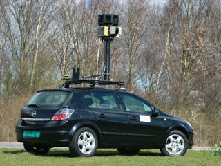 A StreetView car - probably didn't drive itself into the field...we think
