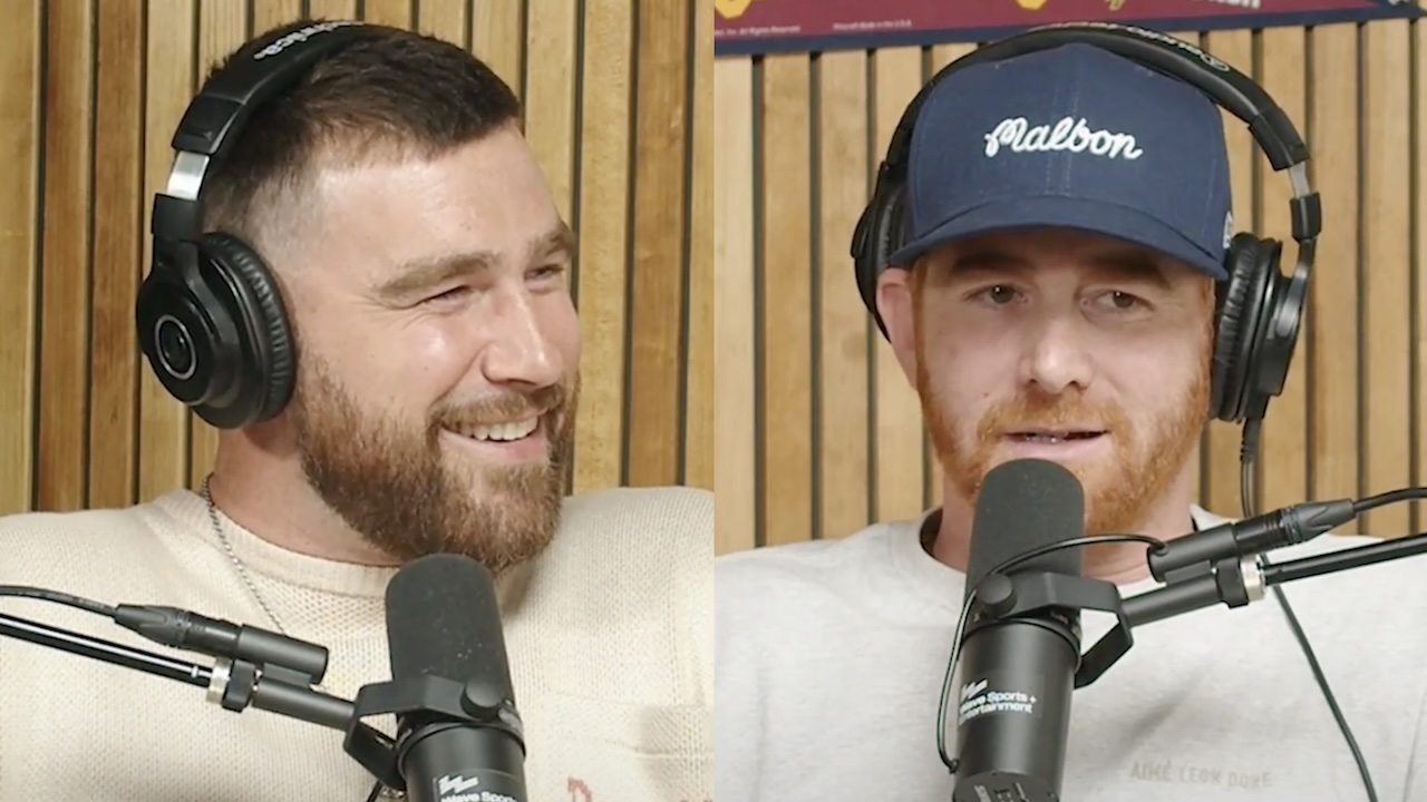 Travis Kelce talking to Andrew Santino and laughing on his New Heights podcast.