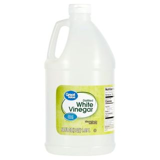 A large translucent white bottle of Great Value Distilled White Vinegar, 64 Fl Oz